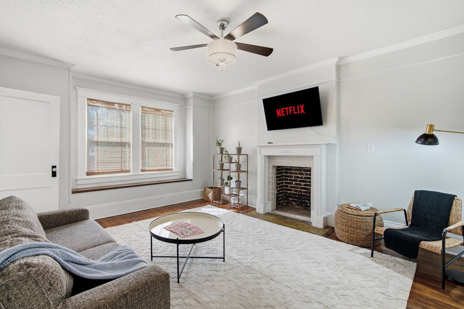 Living room with plush sofa, lounge chair and smart TV