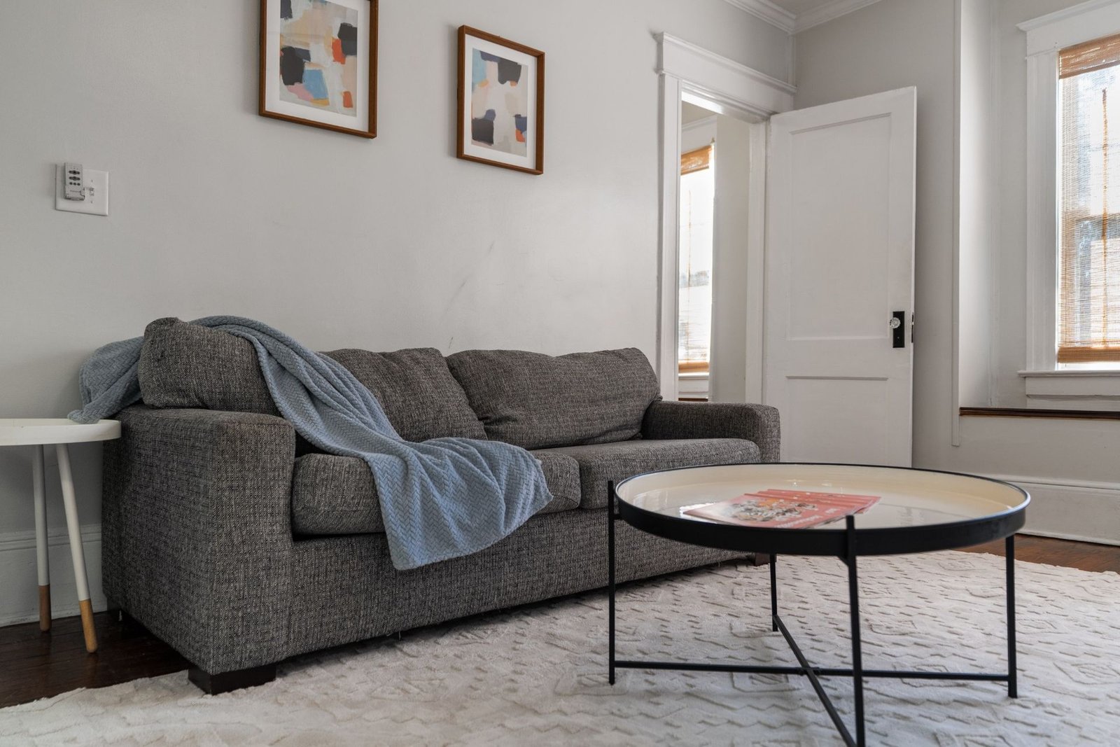 Cozy sofa with throw blanket