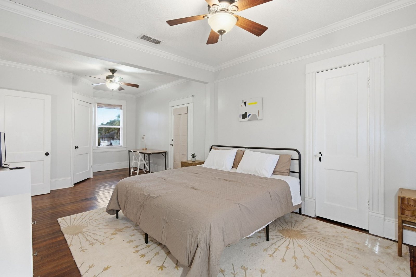 Primary suite bed with plenty of closet space