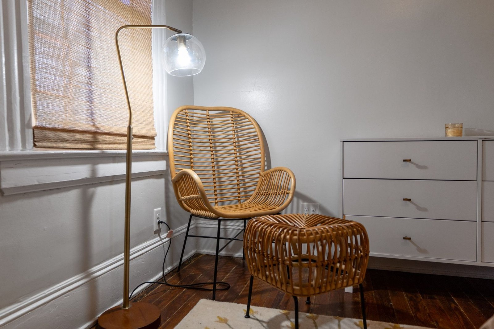 Rattan reading chair in the primary suite